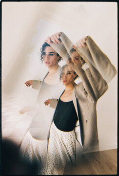 Queer model posing with double exposure effect