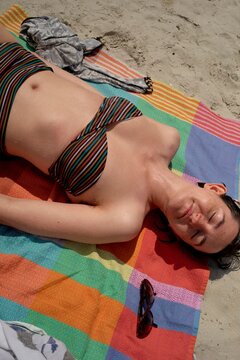 Sunbather Relaxing on Colorful Towel in Marseilles, France
