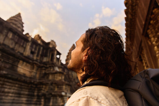 Man looking at temple building in Siem Reap