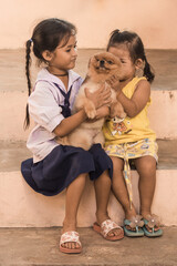 Cute Asian childs with pomeranian dog
