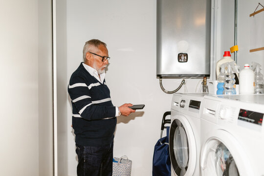 Senior Man Doing Laundry 