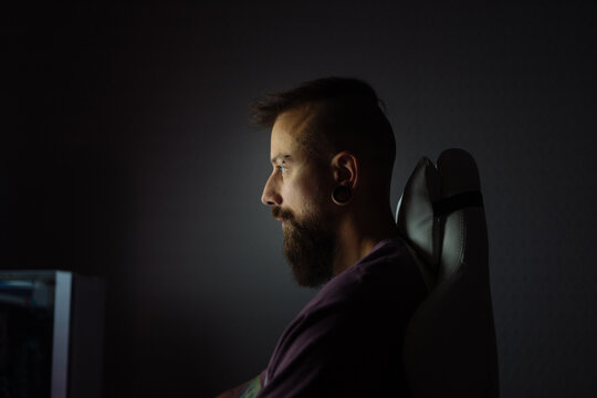 Creative man coding alone at night