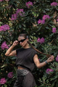 Female Runner in Floral Garden with Confident Pose