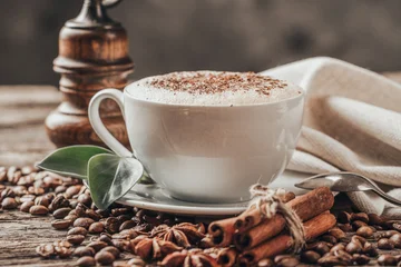 Fototapete Rund Cafe Close-up of coffee cup with roasted coffee beans on wooden background.  © zadorozhna