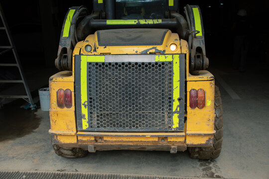 Heavy machinery parked in warehouse waiting for next task