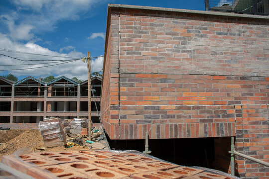 Construction site showcasing brickwork in a residential area