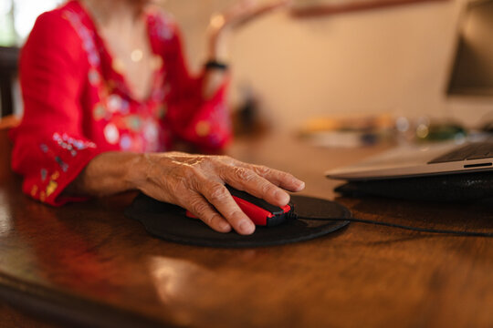 Senior hand using computer mouse