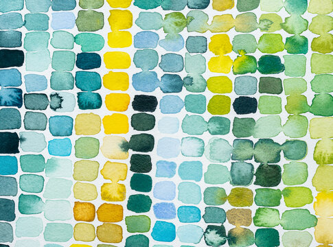 Earthtoned watercolor brushstrokes on paper