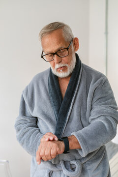 Senior Man Checking Smartwatch