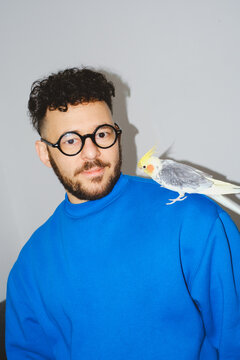 Man with Cockatiel on Shoulder