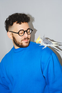 Man with Cockatiel on Shoulder
