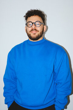 Man in Bright Blue Sweatshirt
