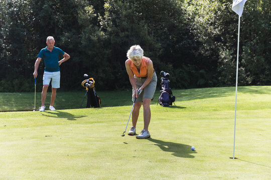 Senior Golfing Couple Playing on the Course