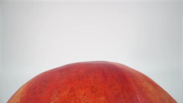 Close up of peach nectarine on white background isolated