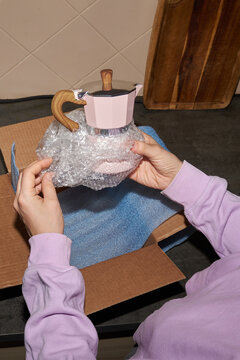 Unboxing a stylish coffee maker at home
