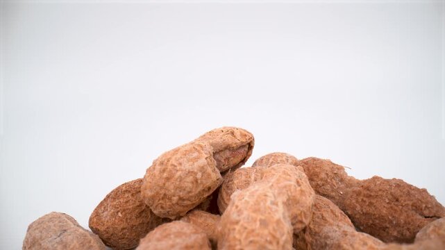 Macro of shelled peanuts on white background isolated
