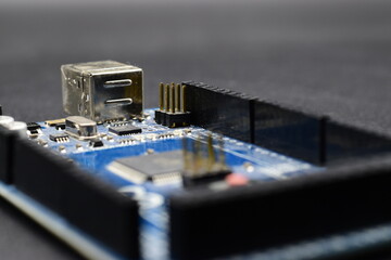 close up of printed circuit board with electronic components 