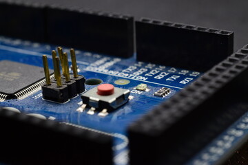close up of printed circuit board with electronic components 