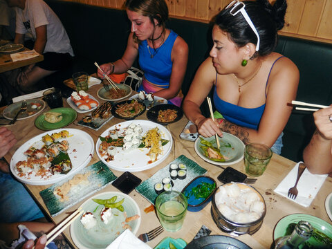 Group Enjoying Dinner at Restaurant
