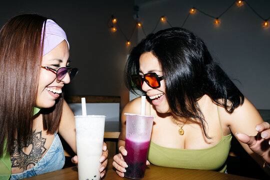 Friends Laughing Over Bubble Tea