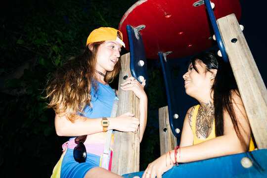 Friends Bonding at Night Playground