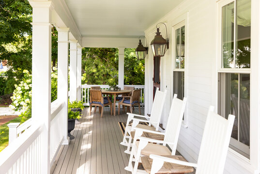 Front porch of home with Rocking Chairs and table 