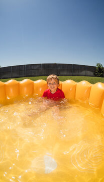 Summer Kid In Kiddie Pool