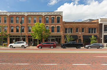 Fototapeta premium Historic downtown commercial buildings with brick road in Detroit
