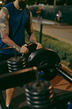 Weight plates stacked on outdoor gym floor