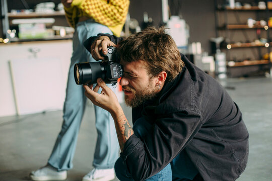 Photographer working during studio shoot