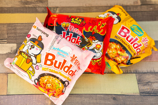 Korean instant ramen, Popular spicy noodle brand Buldak in spicy, cheese and carbonara flavors, global trend popular food product, snack sensation selection, fiery and creamy varieties