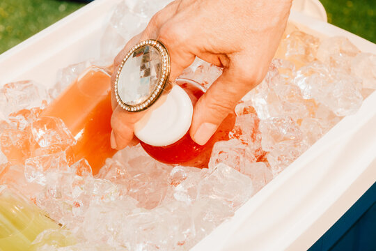 Colorful Drinks in Cooler Filled With Ice