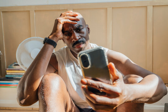 Man Frustrated on the phone or technology