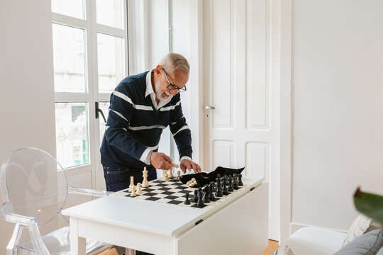 Elderly Man Playing Chess
