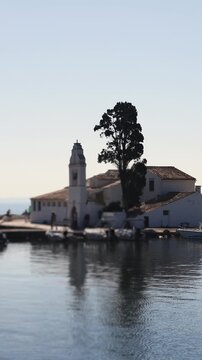Holy Monastery of Panagia Vlacherna, Kanoni, Corfu Island, Kerkyra, Greece, with Ionian sea and Pontikonissi island, beautiful summer sunny day