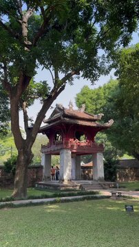 Visitors explore the iconic Khue Van Cac pavilion, a symbol of education and Confucianism, at the Temple of Literature in Hanoi, Vietnam.