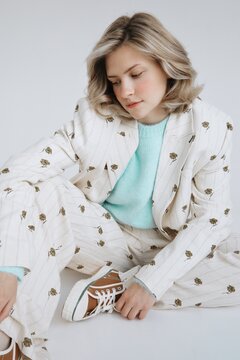 Portrait Woman in Suit Sit on Floor
