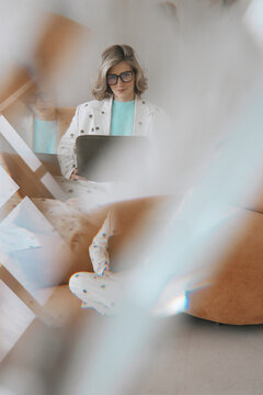 Woman in Suit Working on Laptop 