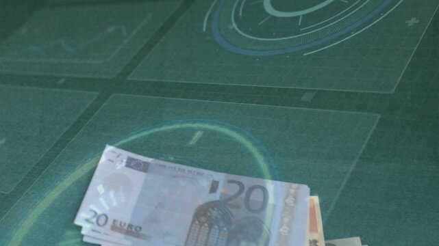 I am adding and fanning 20-euro notes after edge appears, forming stacked pile on green mat