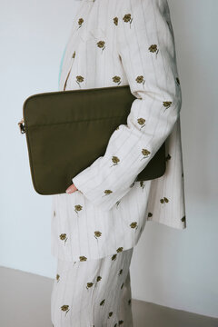 Anonymous woman with laptop case