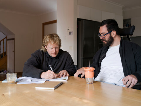 Care worker assisting client with NDIS application