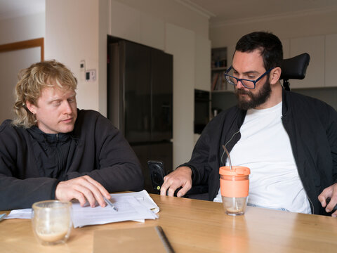 Care worker assisting client with NDIS application 