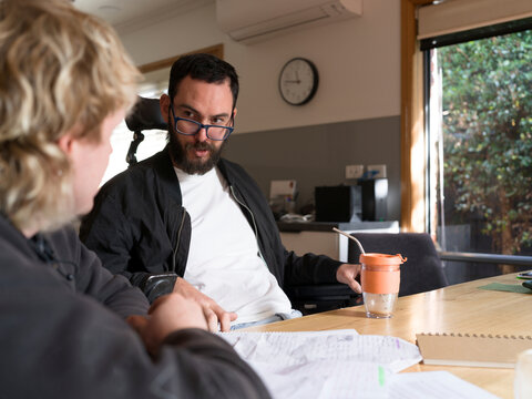 Care worker assisting client with NDIS application