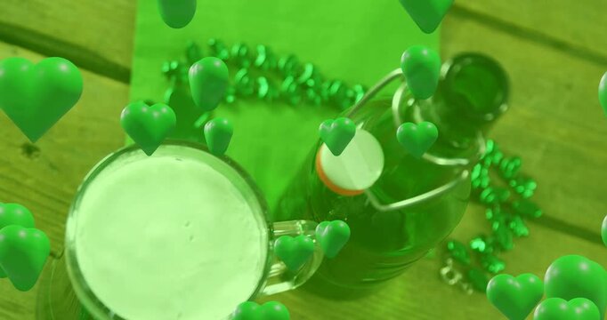 Clear glass beer mug and green bottle showing rising hearts after tilt, forming festive overlay