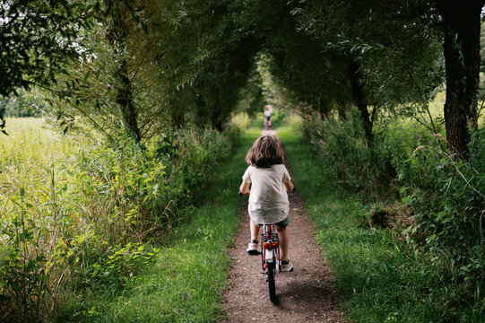 backside view of little girl on bike in Germany