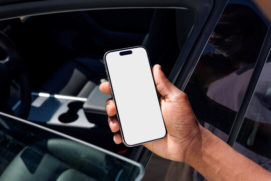 Smartphone Mockup with white screen Held by Car Window