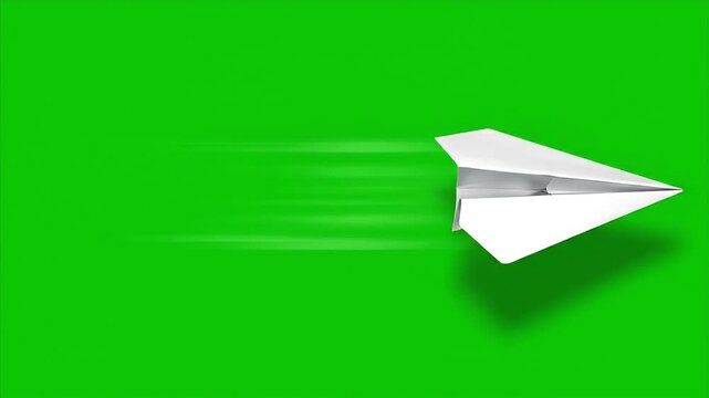White Paper Airplane Flying Fast Across Green Backdrop.