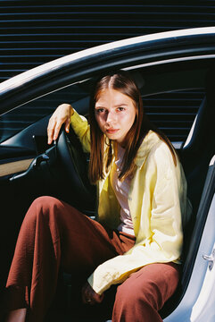 film photo Urban Woman Portrait in Modern Car
