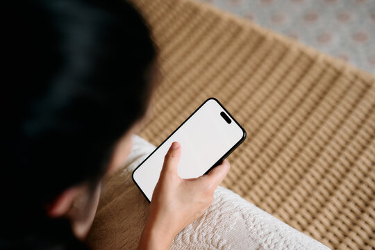 Using a Phone lying face down on the bed