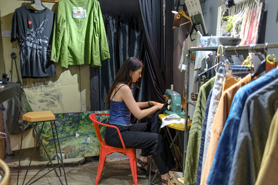 woman sewing on a machine